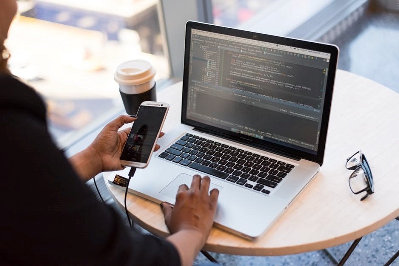 Remote worker on laptop in coffee shop