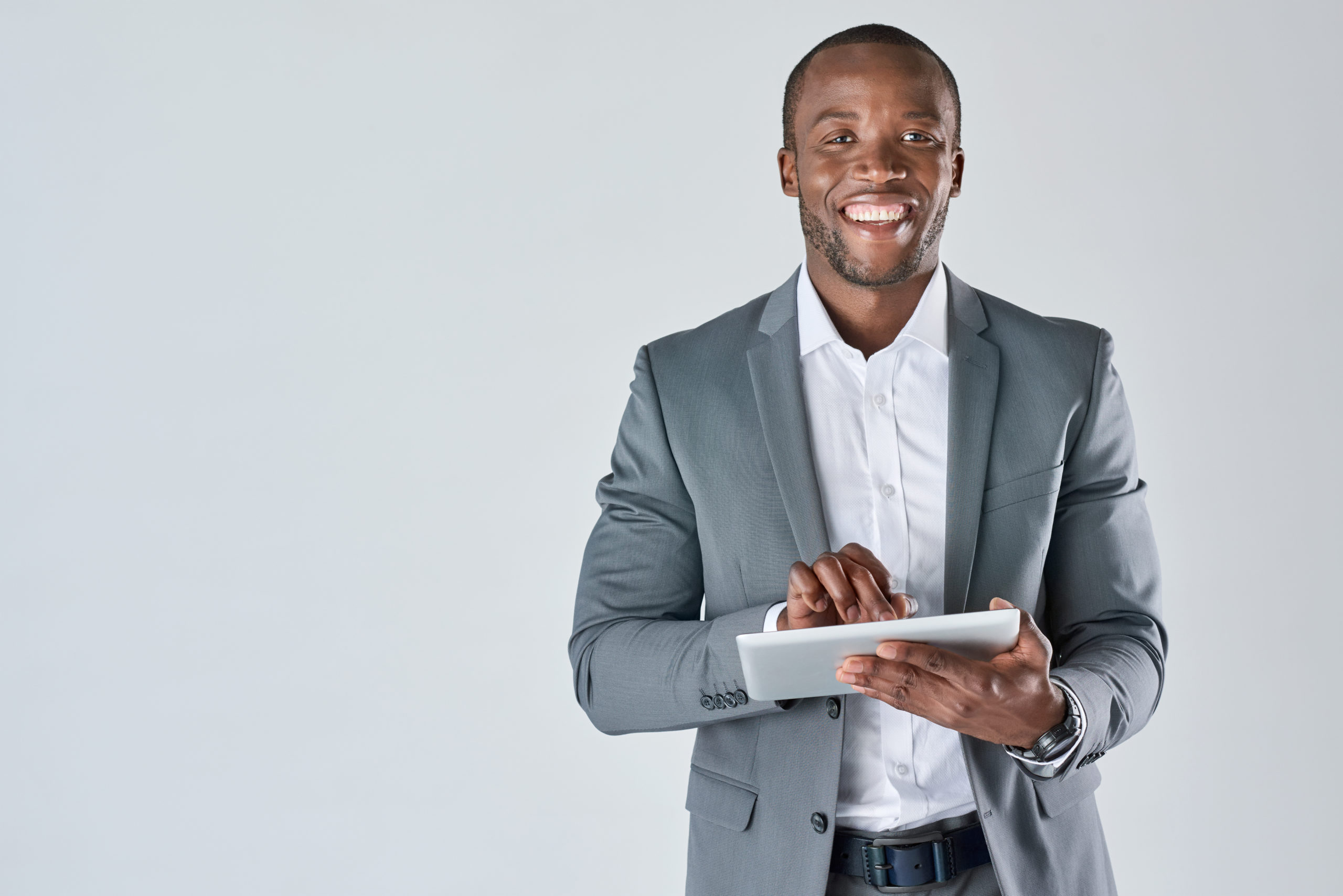 black man with tablet in suit