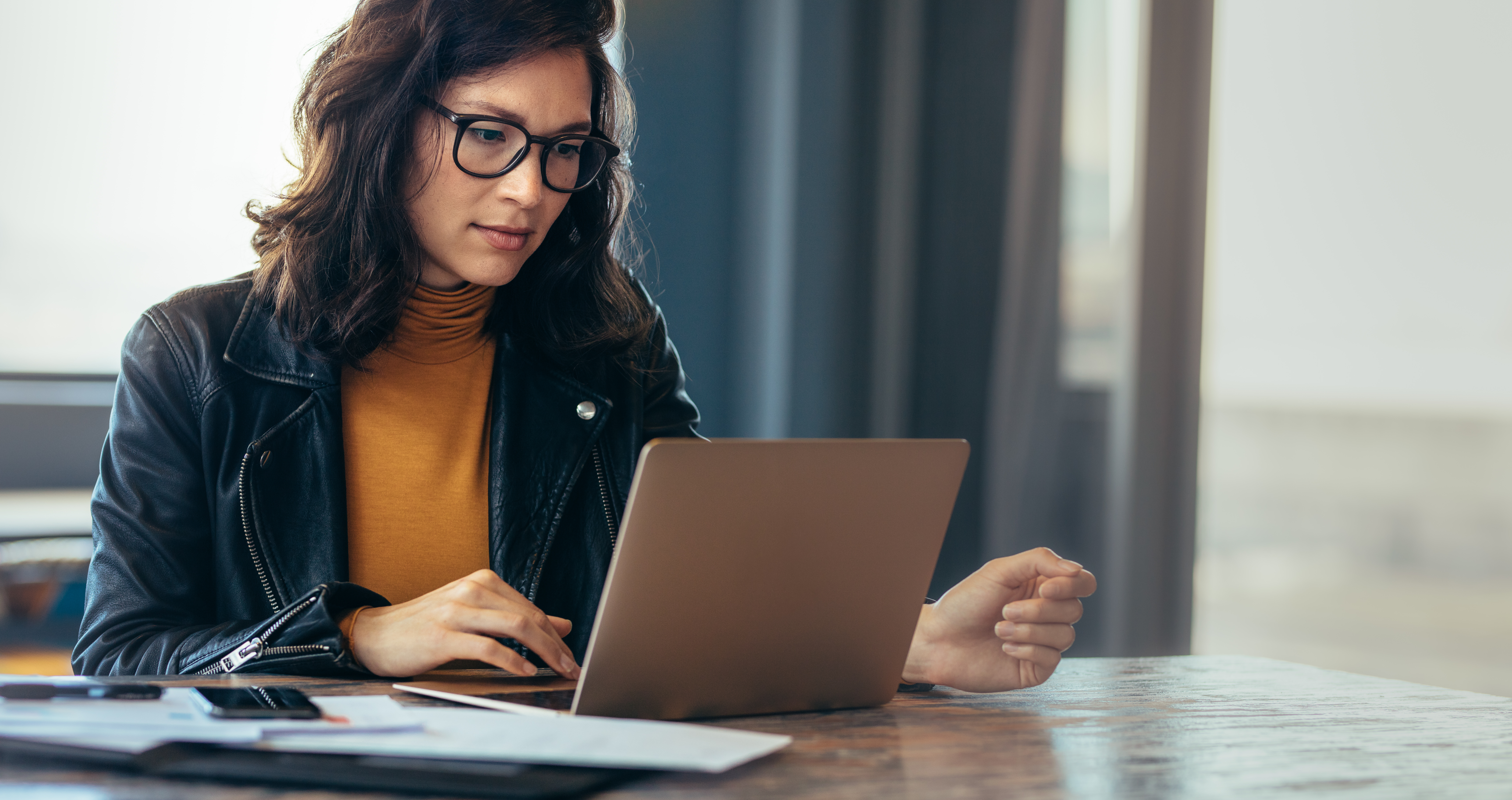 Photo of Asian businesswoman working on laptop