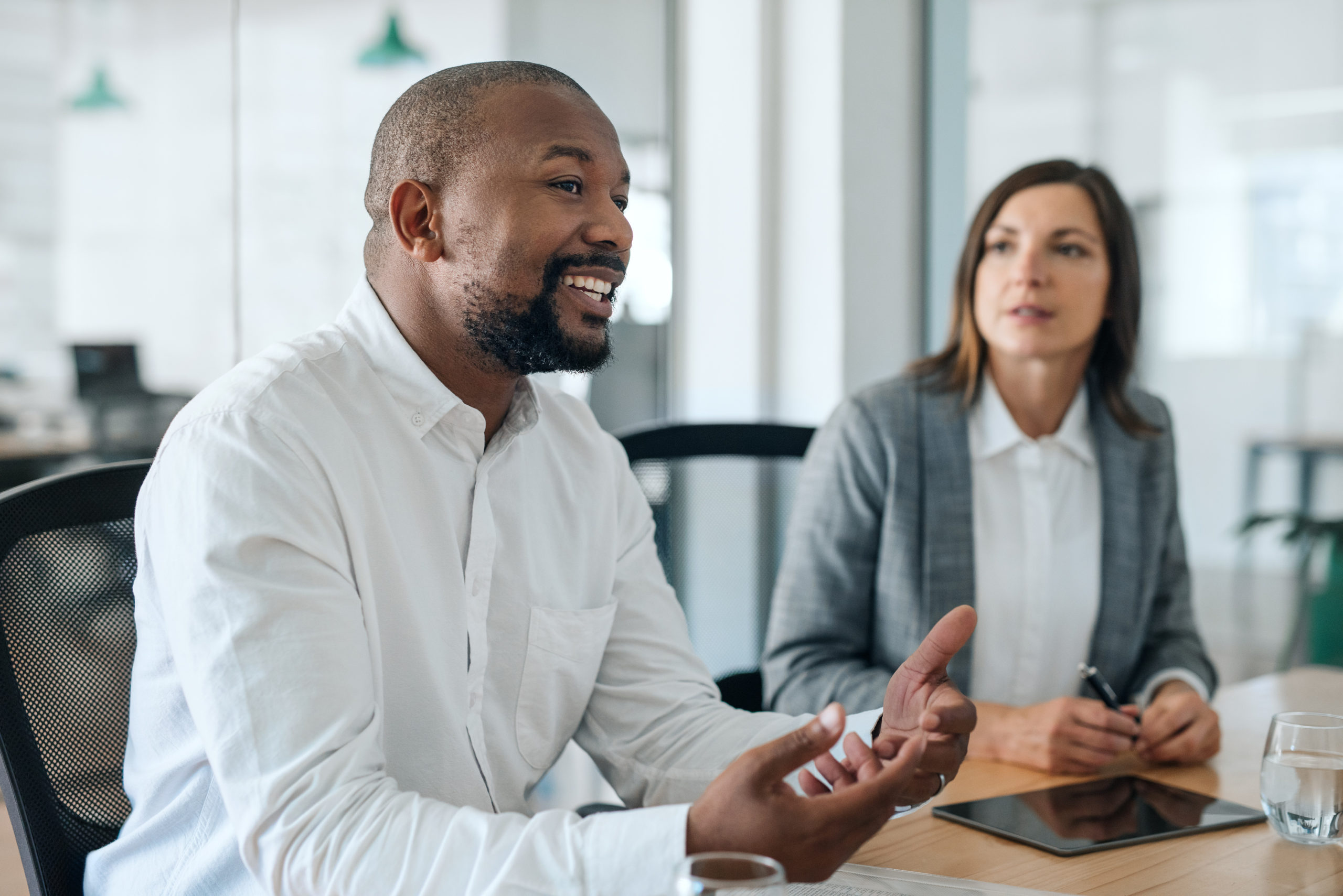 Smiling African American businessman with client