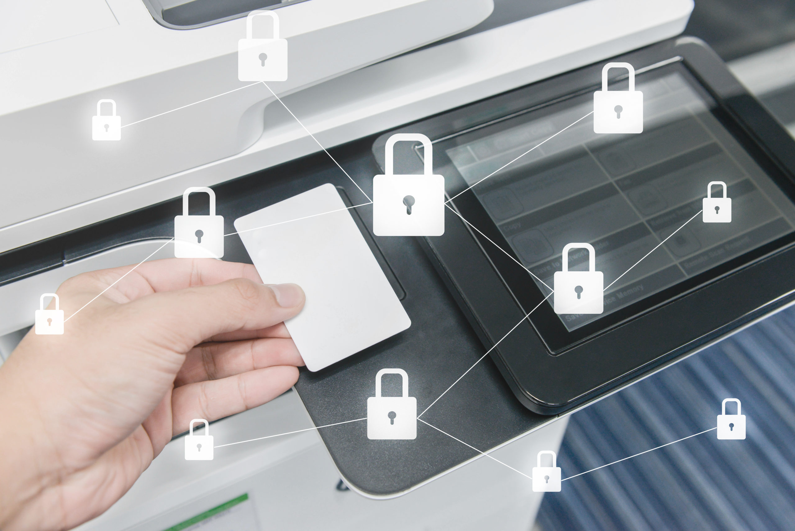 photo of digital lock icons around printer screen with employee using key card to print