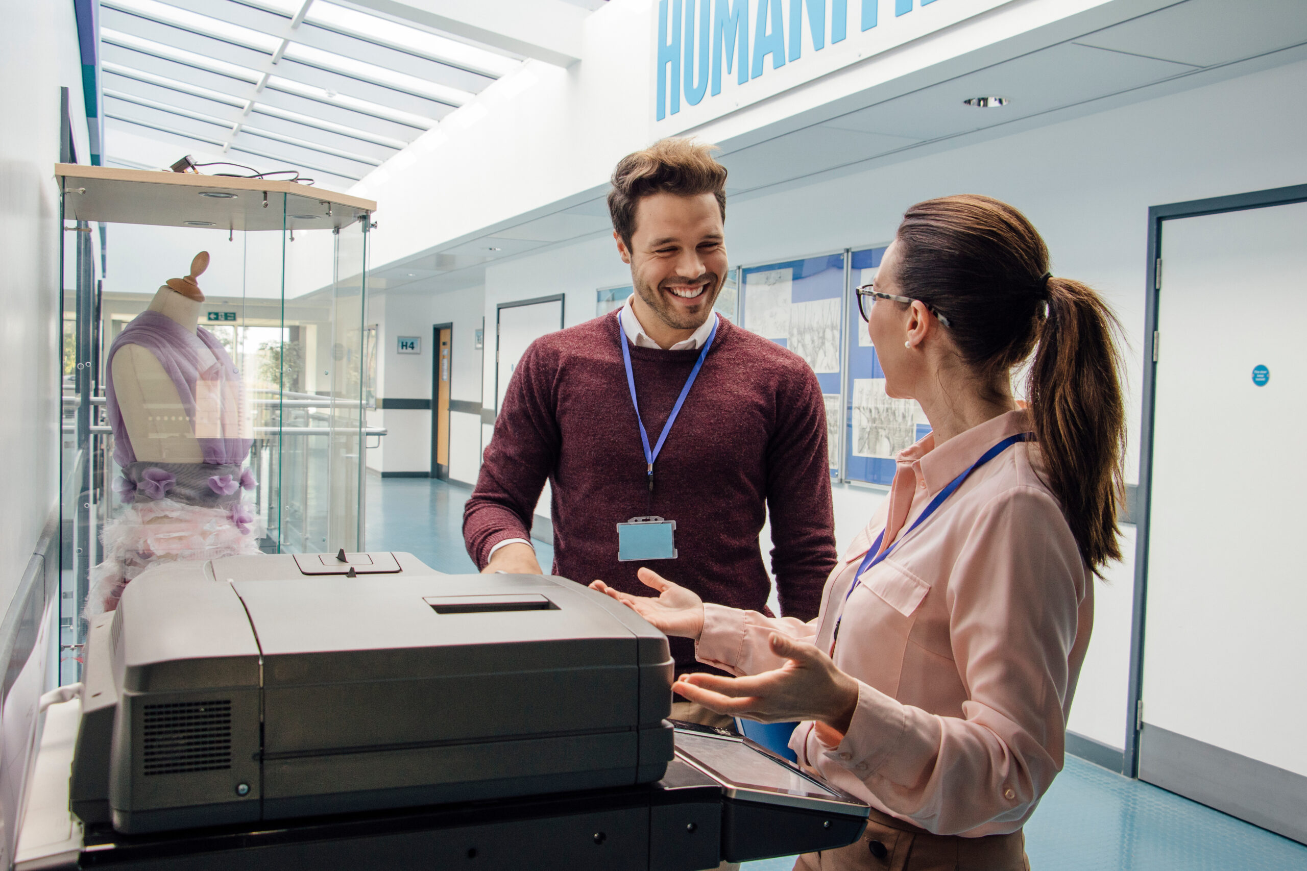 teachers at a printer