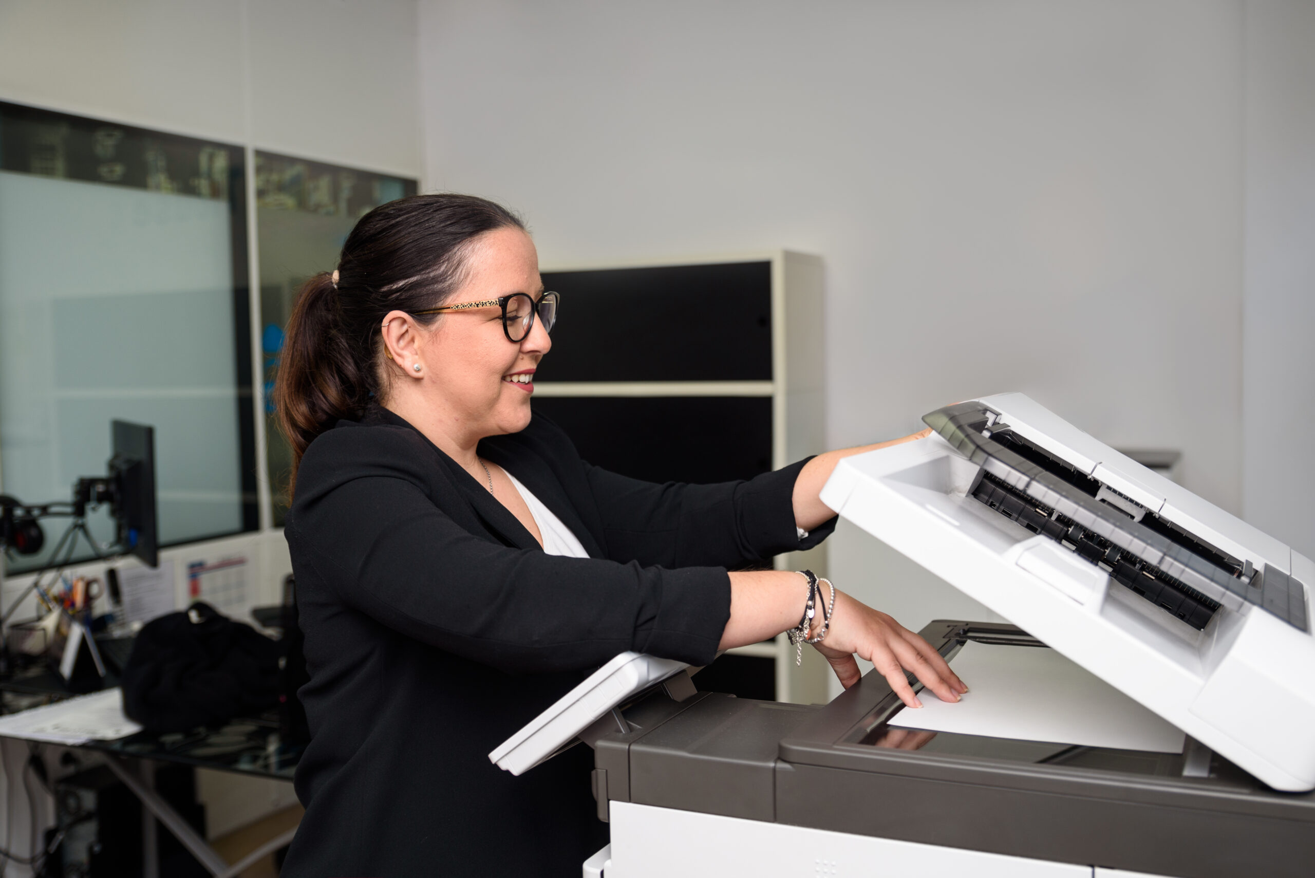 Teacher preparing documents using photocopie