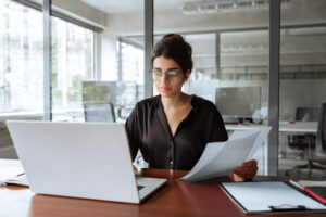 Focused business woman working on laptop