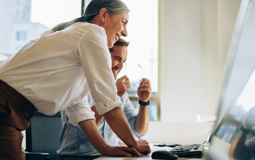 Business people working together on computer