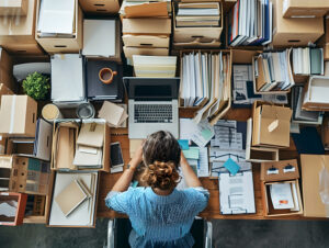 neatly arrange and organize files and documents in an office.
