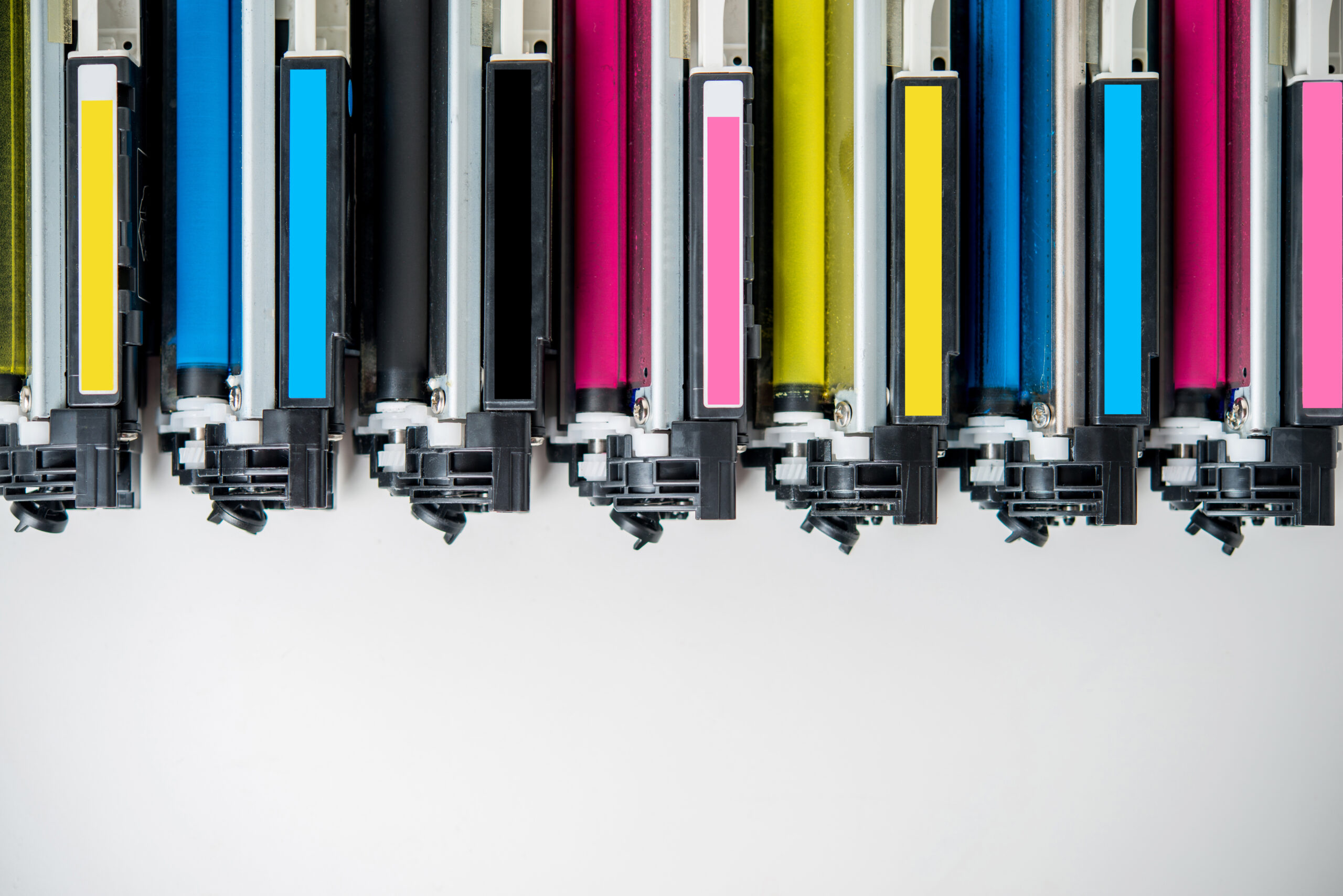 row of used laser toner cartridge