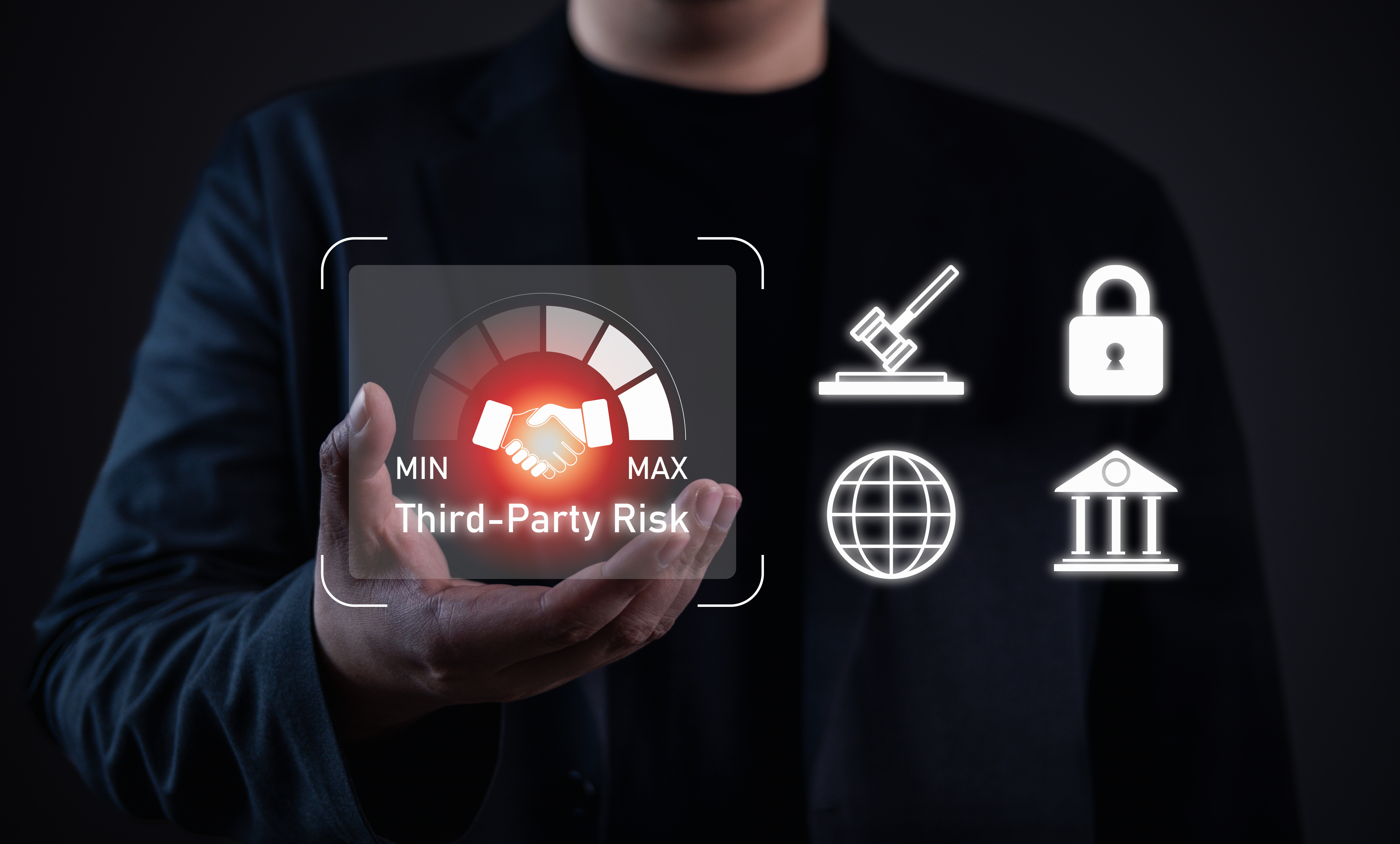 Third-party risk management concept. Businessman holding virtual gauge with handshake icon, highlighting partnership risk, compliance, cybersecurity, and regulatory challenges in business.