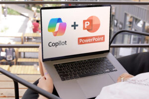 Woman using copilot in powerpoint on laptop